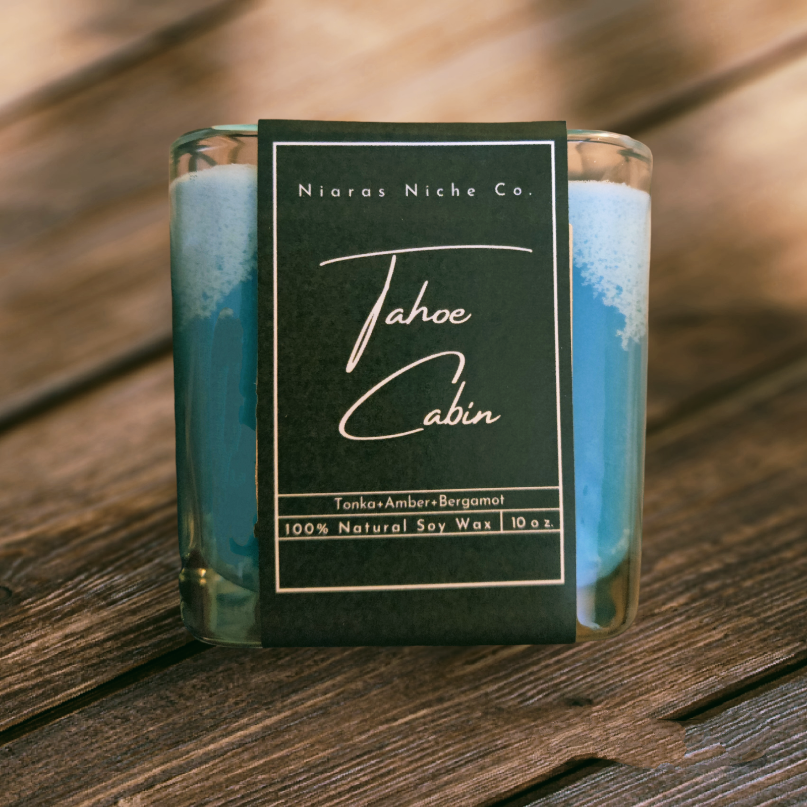 Tahoe Cabin scented candle by Niaras Niche Co. Made with 100% natural soy wax, featuring tonka, amber, and bergamot.