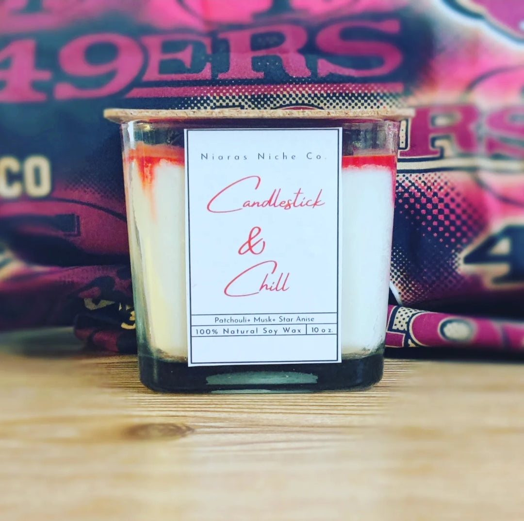 Candlestick & Chill 10oz soy candle by Niaras Niche Co. Scent: Patchouli, musk, and star anise. Clear glass jar with cork lid.